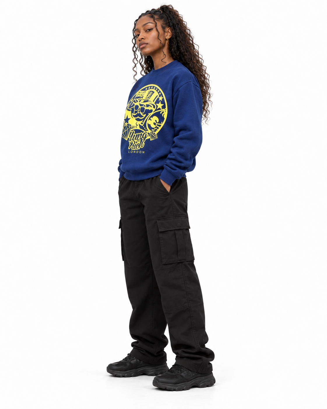 YUNG'N'RICH navy blue women's crewneck jumper with yellow graphic on female model, side angled view
