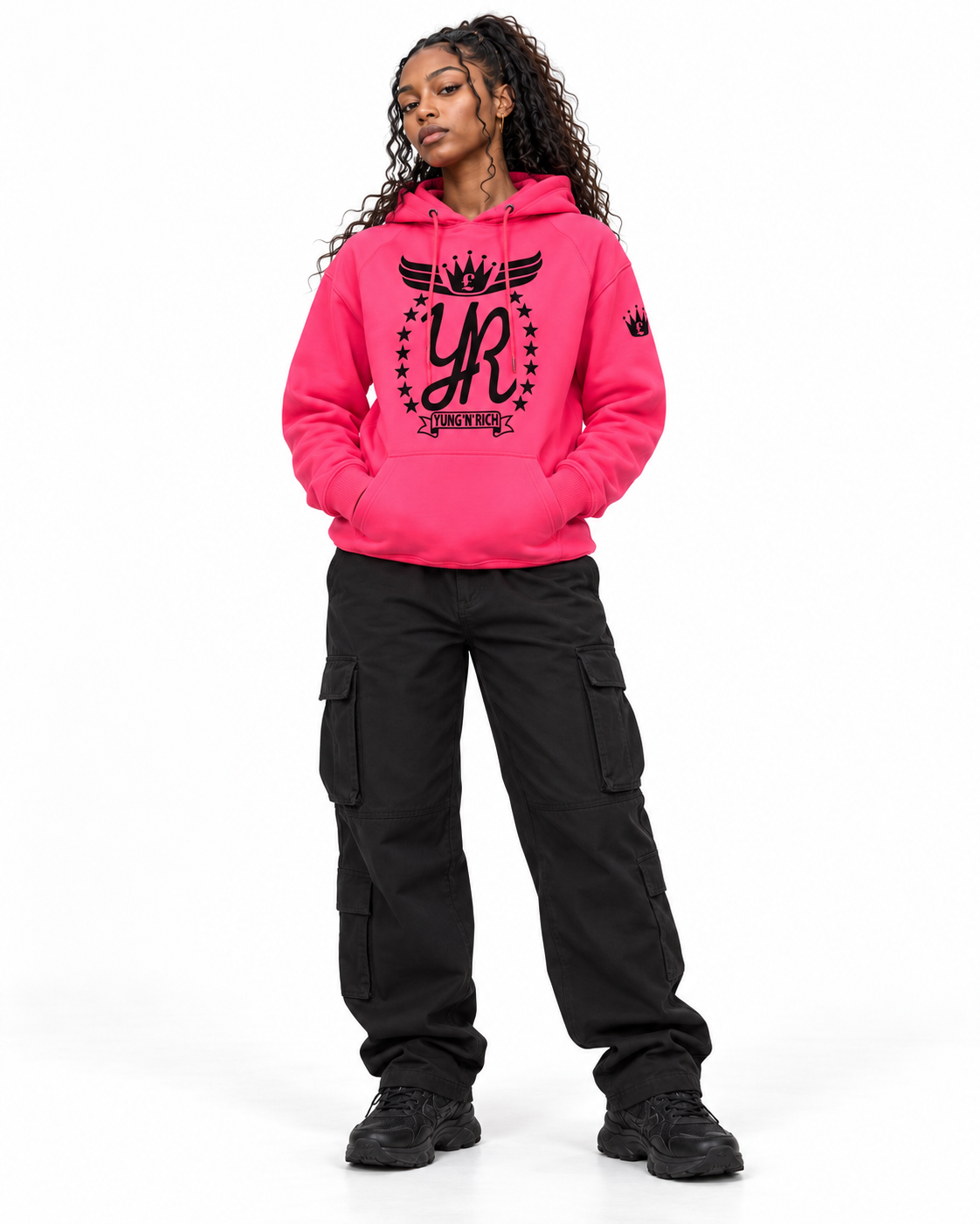 YUNG'N'RICH neon pink women's pullover hoodie on female model, front full-body view