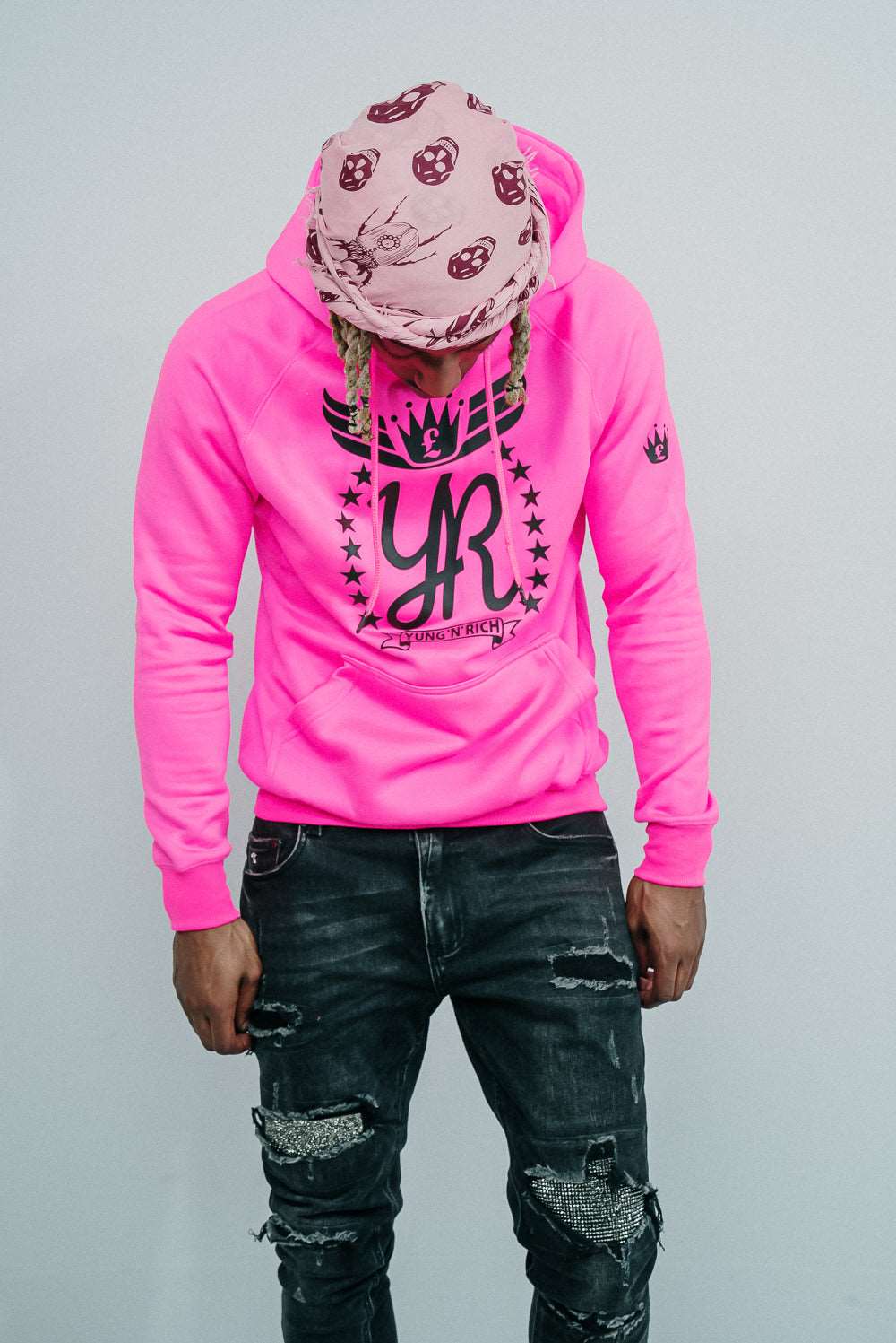 Tizzy Rapper modeling YUNG'N'RICH HOODIE - colour Neon Pink with black rubber Yungnrich logo 