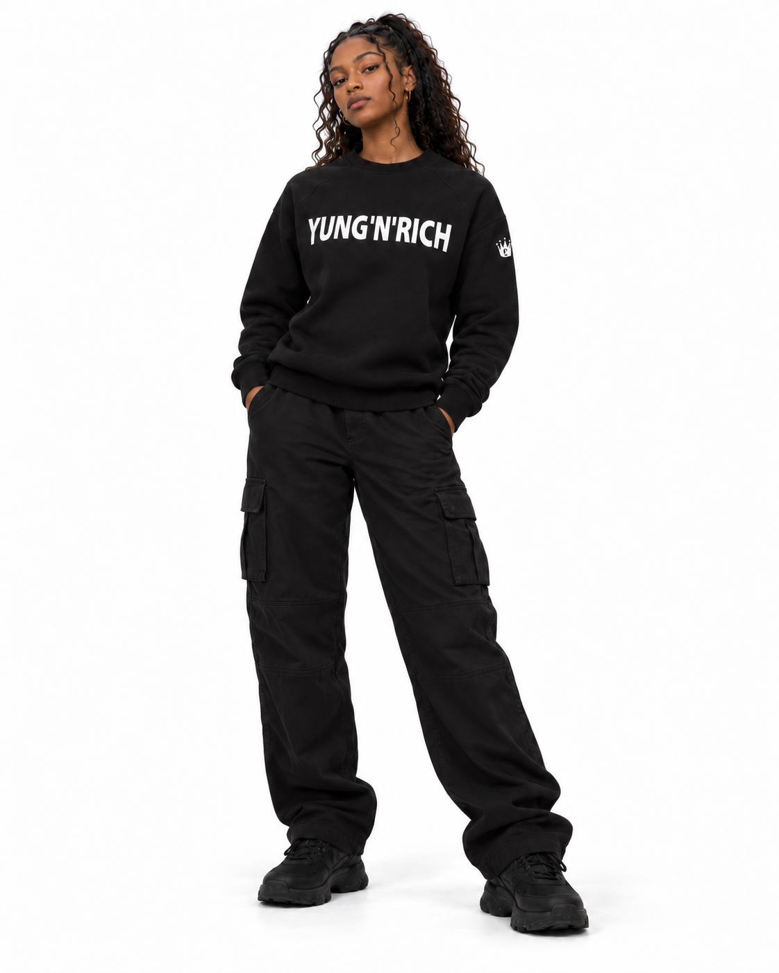 YUNG'N'RICH black women's crewneck jumper on female model, alternative front fashion pose