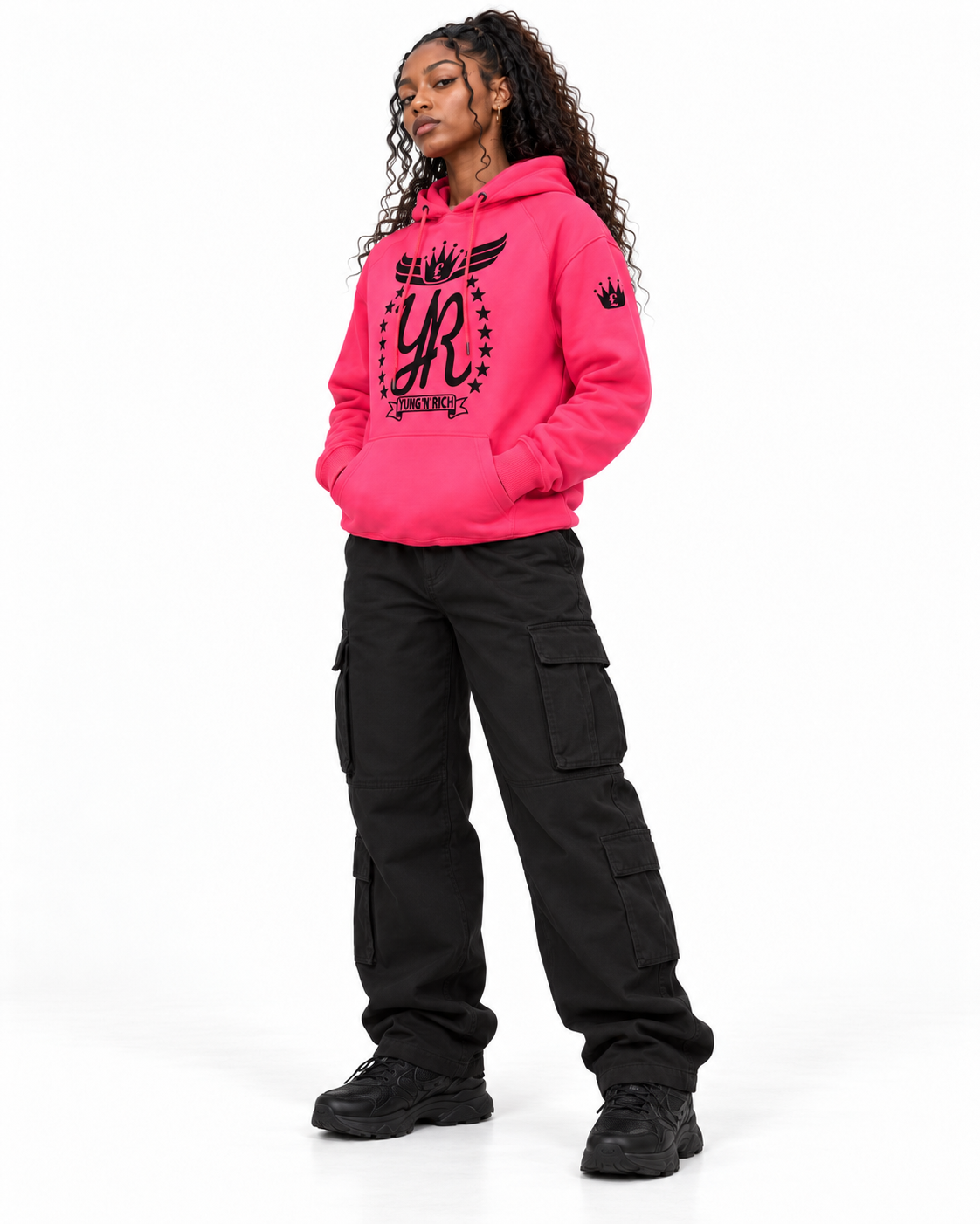 YUNG'N'RICH neon pink women's pullover hoodie on female model, three-quarter right view