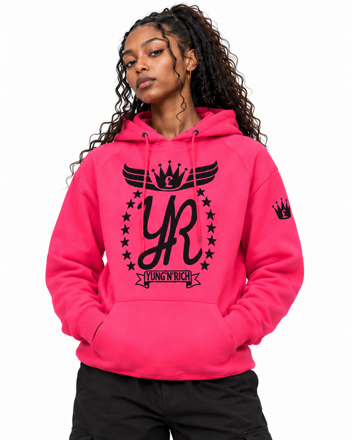 YUNG'N'RICH neon pink women's pullover hoodie on female model, closer front detail view showing the chest logo, hood and sleeve branding