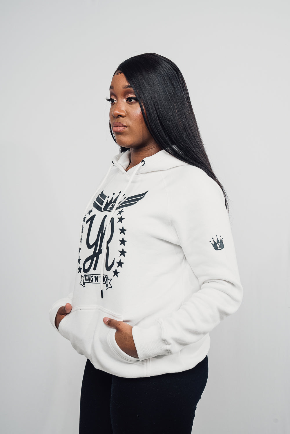 YUNG'N'RICH HOODIE female model - colour white with black rubber Yungnrich logo side veiw with black rubber Yungnrich crown